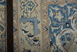 Backside of handmade 2000s Nain rug showing knot structure and weave density