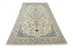 Surface texture of 2000s Nain rug with natural Wool and intricate pattern
