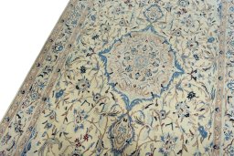 Backside of handmade 2000s Nain rug showing knot structure and weave density