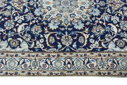 Corner detail of 2000s Nain rug showing border pattern and Wool pile