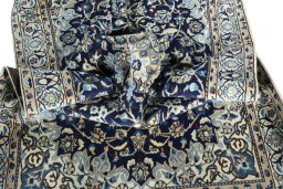 Surface texture of 2000s Nain rug with natural Wool and intricate pattern