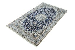 Corner detail of 2000s Nain rug showing border pattern and Wool pile