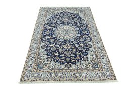 Surface texture of 2000s Nain rug with natural Wool and intricate pattern