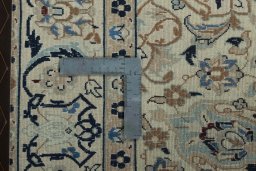 Surface texture of 2000s Nain rug with natural Wool and intricate pattern