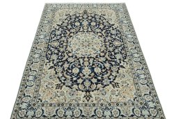Surface texture of 2000s Nain rug with natural Wool and intricate pattern