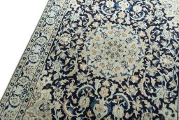 Backside of handmade 2000s Nain rug showing knot structure and weave density