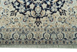 Close-up detail of 2000s Nain rug from Iran / Persia showing Wool weave