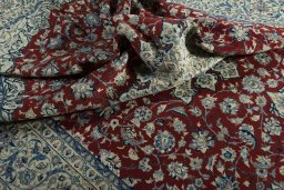 Surface texture of 2000s Nain rug with natural Wool and intricate pattern