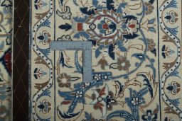 Backside of handmade 2000s Nain rug showing knot structure and weave density