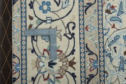 Backside of handmade 2000s Nain rug showing knot structure and weave density