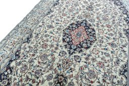 Backside of handmade 2000s Nain rug showing knot structure and weave density