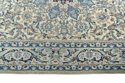 Corner detail of 2000s Nain rug showing border pattern and Wool pile