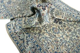 Surface texture of 2000s Nain rug with natural Wool and intricate pattern