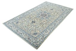Corner detail of 2000s Nain rug showing border pattern and Wool pile