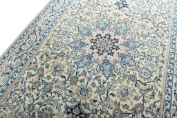 Backside of handmade 2000s Nain rug showing knot structure and weave density