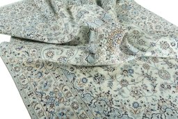 Surface texture of 2000s Nain rug with natural Wool and intricate pattern