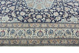 Corner detail of 2000s Nain rug showing border pattern and Wool pile