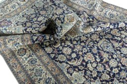 Surface texture of 2000s Nain rug with natural Wool and intricate pattern