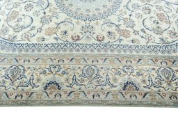 Corner detail of 2000s Nain rug showing border pattern and Wool pile