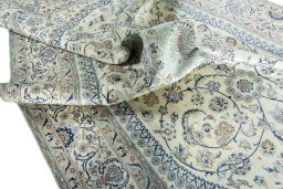 Surface texture of 2000s Nain rug with natural Wool and intricate pattern
