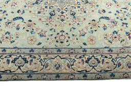 Corner detail of 2000s Nain rug showing border pattern and Wool pile