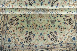 Close-up detail of 2000s Nain rug from Iran / Persia showing Wool weave