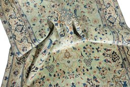 Surface texture of 2000s Nain rug with natural Wool and intricate pattern