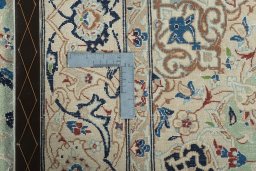 Backside of handmade 2000s Nain rug showing knot structure and weave density