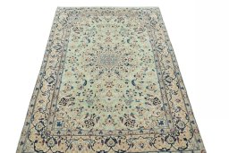 Surface texture of 2000s Nain rug with natural Wool and intricate pattern