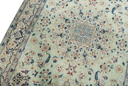 Backside of handmade 2000s Nain rug showing knot structure and weave density