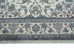 Corner detail of 2000s Nain rug showing border pattern and Wool pile