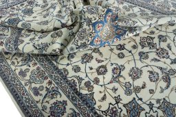 Backside of handmade 2000s Nain rug showing knot structure and weave density