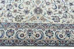 Corner detail of 2000s Nain rug showing border pattern and Wool pile
