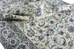 Surface texture of 2000s Nain rug with natural Wool and intricate pattern