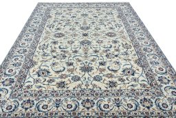 Surface texture of 2000s Nain rug with natural Wool and intricate pattern