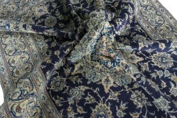 Surface texture of 2000s Nain rug with natural Wool and intricate pattern