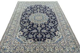 Surface texture of 2000s Nain rug with natural Wool and intricate pattern