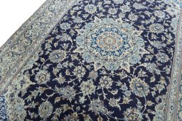 Backside of handmade 2000s Nain rug showing knot structure and weave density