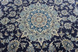 Central medallion detail of 2000s Nain rug from Iran / Persia