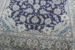 Close-up detail of 2000s Nain rug from Iran / Persia showing Wool weave