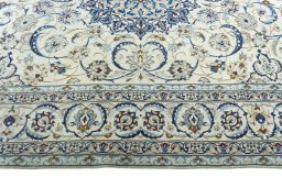 Corner detail of 2000s Nain rug showing border pattern and Wool pile