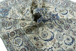 Surface texture of 2000s Nain rug with natural Wool and intricate pattern