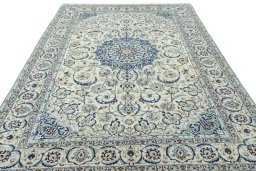 Surface texture of 2000s Nain rug with natural Wool and intricate pattern