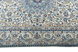 Corner detail of 2000s Nain rug showing border pattern and Wool pile