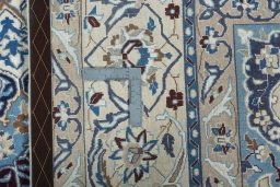 Backside of handmade 2000s Nain rug showing knot structure and weave density