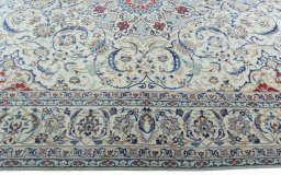 Corner detail of 2000s Nain rug showing border pattern and Wool pile