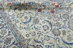 Backside of handmade 2000s Nain rug showing knot structure and weave density