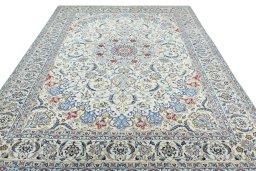 Surface texture of 2000s Nain rug with natural Wool and intricate pattern