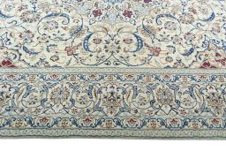 Corner detail of 2000s Nain rug showing border pattern and Wool pile