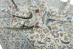 Surface texture of 2000s Nain rug with natural Wool and intricate pattern